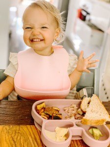 baby eating food at the table
